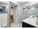 Bathroom vanity with large mirror and view of shower at 19029 Us Highway 19 N # 5-14, Clearwater, FL 33764