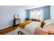 Comfortable bedroom featuring light blue walls and natural light at 19029 Us Highway 19 N # 5-14, Clearwater, FL 33764