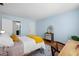 Bedroom featuring light blue walls and doorway to bath at 19029 Us Highway 19 N # 5-14, Clearwater, FL 33764