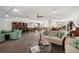 Spacious common room with comfortable seating, a bookcase, and lots of tables with chairs at 19029 Us Highway 19 N # 5-14, Clearwater, FL 33764