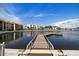 Beautiful waterfront views from the community dock, reflecting nearby buildings at 19029 Us Highway 19 N # 5-14, Clearwater, FL 33764