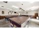 This game room features pool tables, card tables, and casual seating for friendly competition at 19029 Us Highway 19 N # 5-14, Clearwater, FL 33764