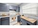 Cozy kitchen featuring neutral cabinets and modern appliances at 19029 Us Highway 19 N # 5-14, Clearwater, FL 33764