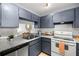 Updated kitchen with stainless steel appliances and granite countertops at 19029 Us Highway 19 N # 5-14, Clearwater, FL 33764