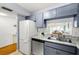 Kitchen with stainless steel dishwasher and breakfast bar at 19029 Us Highway 19 N # 5-14, Clearwater, FL 33764