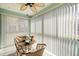 Relaxing lanai with wicker furniture and a ceiling fan, offering a private outdoor space with natural light at 19029 Us Highway 19 N # 5-14, Clearwater, FL 33764