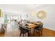 Bright living room showcasing hardwood floors, modern decor, and a sliding glass door leading to the lanai at 19029 Us Highway 19 N # 5-14, Clearwater, FL 33764