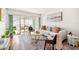 Cozy living room with a comfortable sofa, modern decor, and access to a screened lanai with outdoor seating at 19029 Us Highway 19 N # 5-14, Clearwater, FL 33764