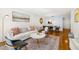 Open-concept living space with a comfortable sofa, stylish decor, and a view to the dining area and lanai at 19029 Us Highway 19 N # 5-14, Clearwater, FL 33764