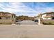 Exterior shot of the parking lot with a view of the condos, displaying ample parking space for residents and guests at 19029 Us Highway 19 N # 5-14, Clearwater, FL 33764