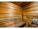 An indoor sauna featuring wooden benches and a place to pour water on hot rocks at 19029 Us Highway 19 N # 5-14, Clearwater, FL 33764