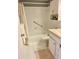 Clean, white bathroom with tiled walls, a shower-tub combination, and vanity at 1921 58Th N Ave # 11, St Petersburg, FL 33714