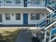 Charming condo with a welcoming entrance and modern exterior staircase at 1921 58Th N Ave # 11, St Petersburg, FL 33714