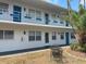 Inviting condo exterior featuring a quaint patio and updated fixtures at 1921 58Th N Ave # 11, St Petersburg, FL 33714