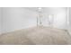Bright bedroom with neutral carpet, a ceiling fan, and ensuite bathroom at 19819 Tattnall Way, Brooksville, FL 34601