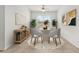 An interior dining room with a neutral palette, stylish decor, and sunlit windows, perfect for gatherings at 19819 Tattnall Way, Brooksville, FL 34601