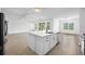 Open-concept kitchen and living area with center island and modern appliances, great for gatherings and Gathering time at 19819 Tattnall Way, Brooksville, FL 34601