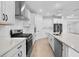 Well-appointed kitchen boasting stainless steel appliances, ample counter space, and sleek finishes, creating a culinary haven at 19819 Tattnall Way, Brooksville, FL 34601