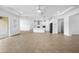 Open-concept living room showcases tiled floors leading to the kitchen and dining areas at 19819 Tattnall Way, Brooksville, FL 34601