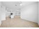 Bright, open-concept living space showcasing tile flooring and abundant natural light throughout the house at 19819 Tattnall Way, Brooksville, FL 34601