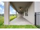 Long covered patio offers shaded place to enjoy the backyard at 19819 Tattnall Way, Brooksville, FL 34601