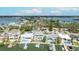 Aerial view of homes with private docks on the bay in a community with peaceful waterways at 2010 20Th Avenue Pkwy, Indian Rocks Beach, FL 33785