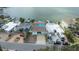 Aerial shot showcasing the waterfront home, expansive driveway, and proximity to the water at 2010 20Th Avenue Pkwy, Indian Rocks Beach, FL 33785