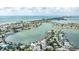 Panoramic aerial view of a waterfront property with a lush, green yard and stunning water views at 2010 20Th Avenue Pkwy, Indian Rocks Beach, FL 33785