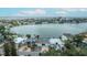 Drone shot of the coastal property with water access, neighborhood, and beautiful bay views at 2010 20Th Avenue Pkwy, Indian Rocks Beach, FL 33785
