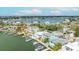 Bayfront homes, docks, and lush landscaping offer a serene waterfront living experience from above at 2010 20Th Avenue Pkwy, Indian Rocks Beach, FL 33785