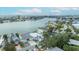 Aerial view captures this waterfront property's location, community, and stunning water scenery at 2010 20Th Avenue Pkwy, Indian Rocks Beach, FL 33785