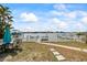 Picturesque backyard with lawn, patio dining set, and stunning water views at 2010 20Th Avenue Pkwy, Indian Rocks Beach, FL 33785