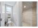 Modern bathroom featuring a toilet and a frameless glass shower with tiled walls at 2010 20Th Avenue Pkwy, Indian Rocks Beach, FL 33785