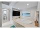 Elegant bathroom with a soaking tub, TV, and serene decor at 2010 20Th Avenue Pkwy, Indian Rocks Beach, FL 33785
