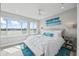 Bright bedroom features coastal decor and stunning water views at 2010 20Th Avenue Pkwy, Indian Rocks Beach, FL 33785