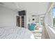 Spacious bedroom featuring a sitting area, kitchenette, and water views at 2010 20Th Avenue Pkwy, Indian Rocks Beach, FL 33785