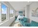 Bright bedroom with scenic water views, sitting area, and stylish decor at 2010 20Th Avenue Pkwy, Indian Rocks Beach, FL 33785