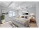 Bright bedroom features a ceiling fan, neutral color palette, and tasteful decorations at 2010 20Th Avenue Pkwy, Indian Rocks Beach, FL 33785