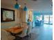 Cozy dining room with stylish pendants and dining table, steps away from the living area at 2010 20Th Avenue Pkwy, Indian Rocks Beach, FL 33785