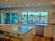 Modern kitchen with granite counters, stainless steel appliances, and stunning waterfront views at 2010 20Th Avenue Pkwy, Indian Rocks Beach, FL 33785
