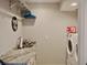 Laundry room with granite countertop, sink, and a modern washer and dryer set at 2010 20Th Avenue Pkwy, Indian Rocks Beach, FL 33785