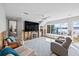 Bright living area with comfortable seating, large windows, and scenic waterfront views at 2010 20Th Avenue Pkwy, Indian Rocks Beach, FL 33785