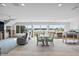 Bright living area with large windows, comfortable seating, and waterfront views at 2010 20Th Avenue Pkwy, Indian Rocks Beach, FL 33785