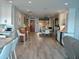 Open-concept living room showcasing hardwood floors, a dining area, and tasteful decor at 2010 20Th Avenue Pkwy, Indian Rocks Beach, FL 33785