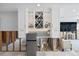Stylish living room with modern cabinetry, a sleek refrigerator, and under-cabinet lighting at 2010 20Th Avenue Pkwy, Indian Rocks Beach, FL 33785