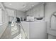 Home office on upper floor featuring custom cabinetry and a desk with multiple monitors at 2010 20Th Avenue Pkwy, Indian Rocks Beach, FL 33785