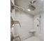 Luxurious shower with dual shower heads, marble walls, and a built-in corner shelf at 2010 20Th Avenue Pkwy, Indian Rocks Beach, FL 33785