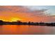 Scenic waterfront community view with a vibrant orange-hued sky during sunset at 2010 20Th Avenue Pkwy, Indian Rocks Beach, FL 33785