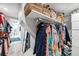 Organized walk-in closet with clothing racks, shelves, and storage baskets at 2010 20Th Avenue Pkwy, Indian Rocks Beach, FL 33785