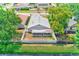 Aerial view of the home showcases a fenced-in backyard and screened-in patio at 22943 Sills Loop, Land O Lakes, FL 34639